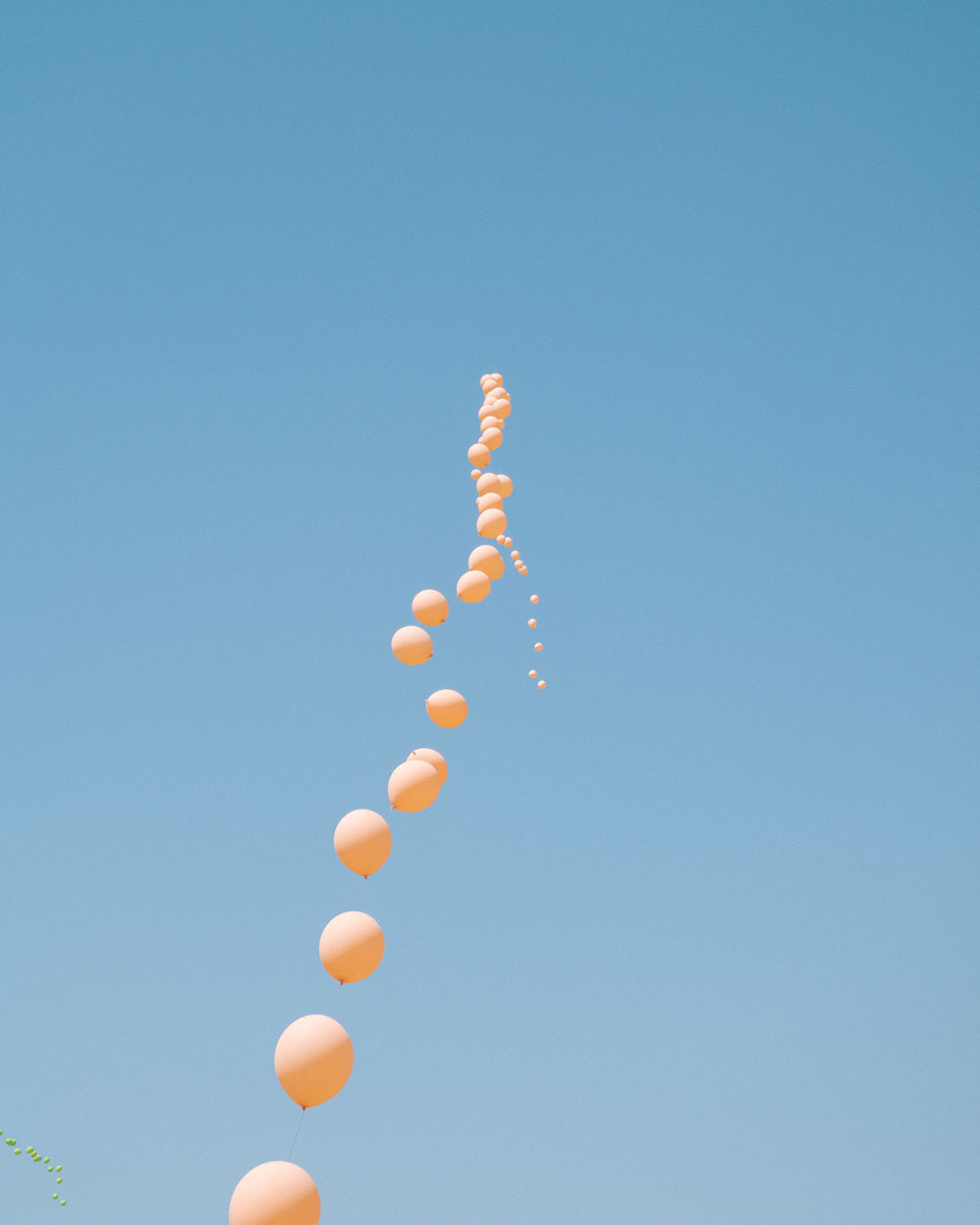 photo of balloon string against sky