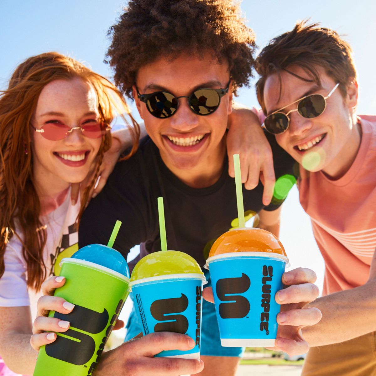 fans drinking Slurpees